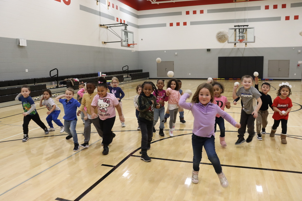 kids throwing white fluffy balls at camera