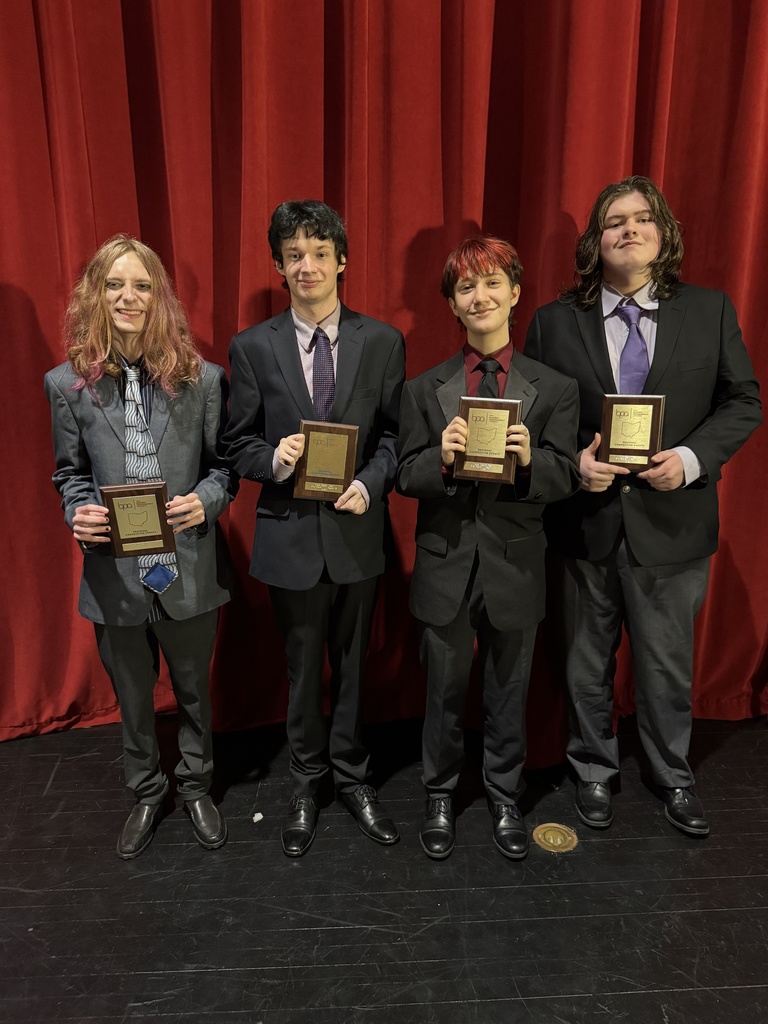 boys holding plaques