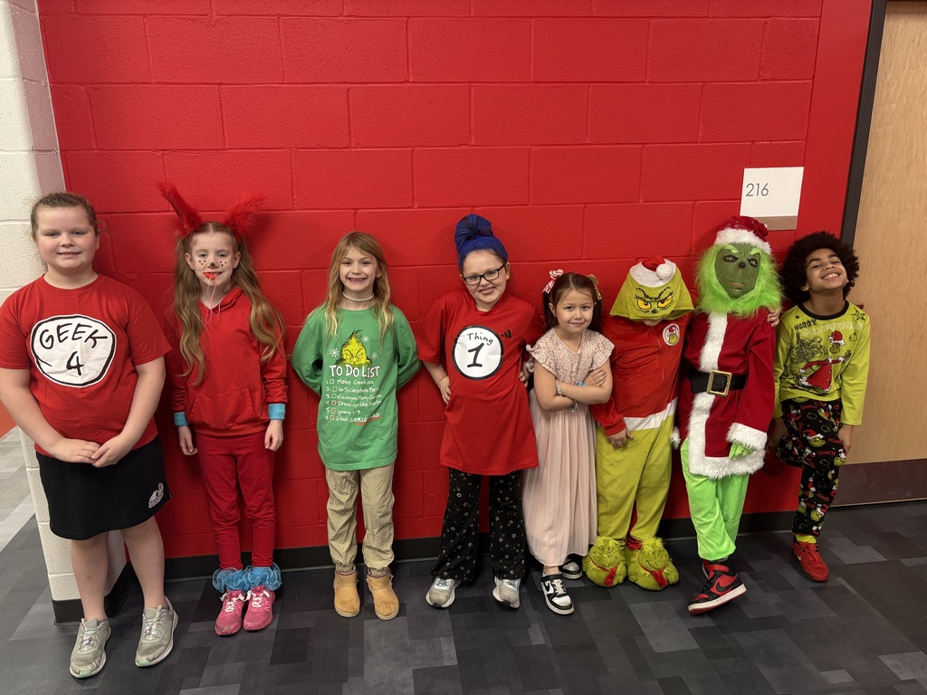8 students dressed as characters from a book