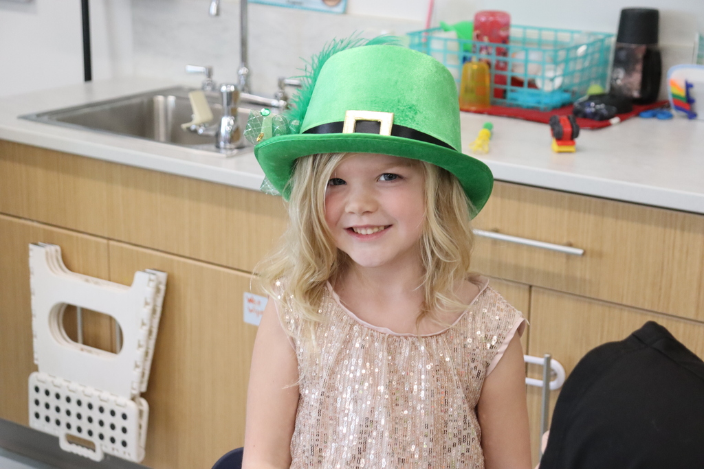 Girl wearing a green hat