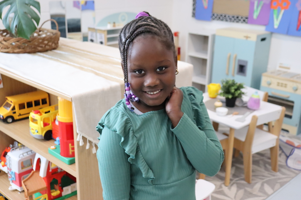 girl smiling wearing green