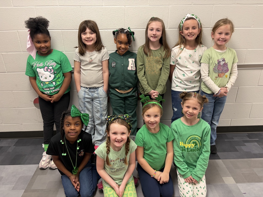 10 girls wearing green
