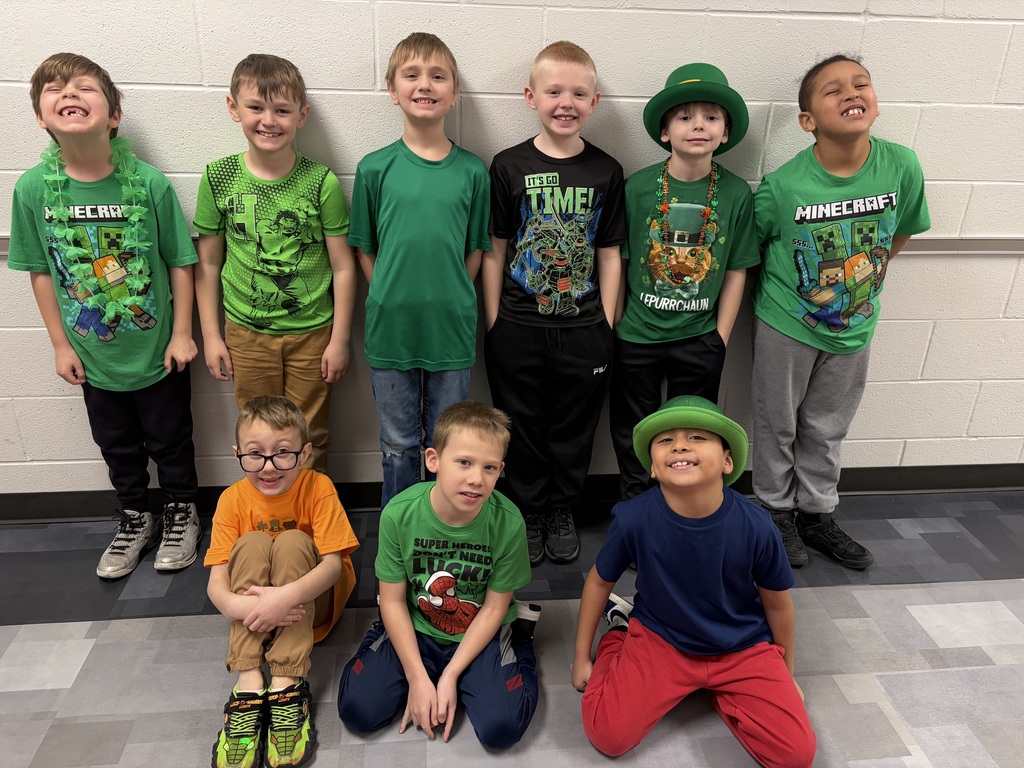 9 boys wearing green