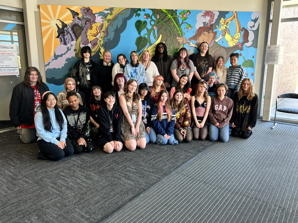Group of students in front of Mural at the Library 