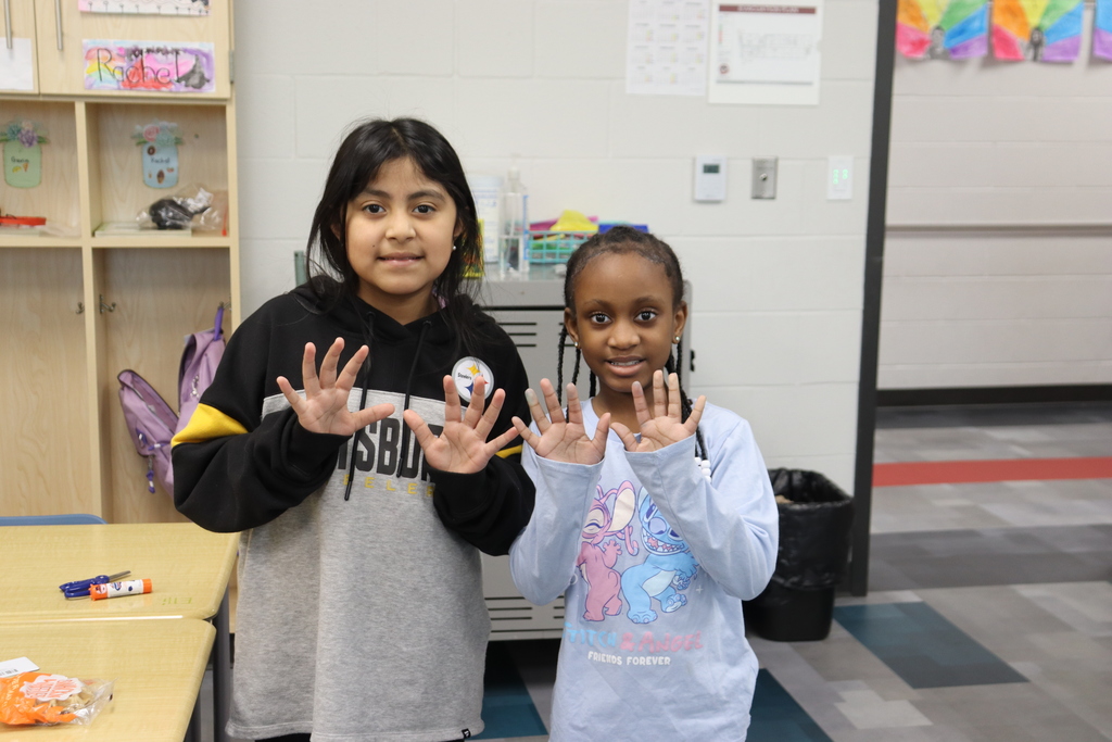 Two girls showing their clean hands