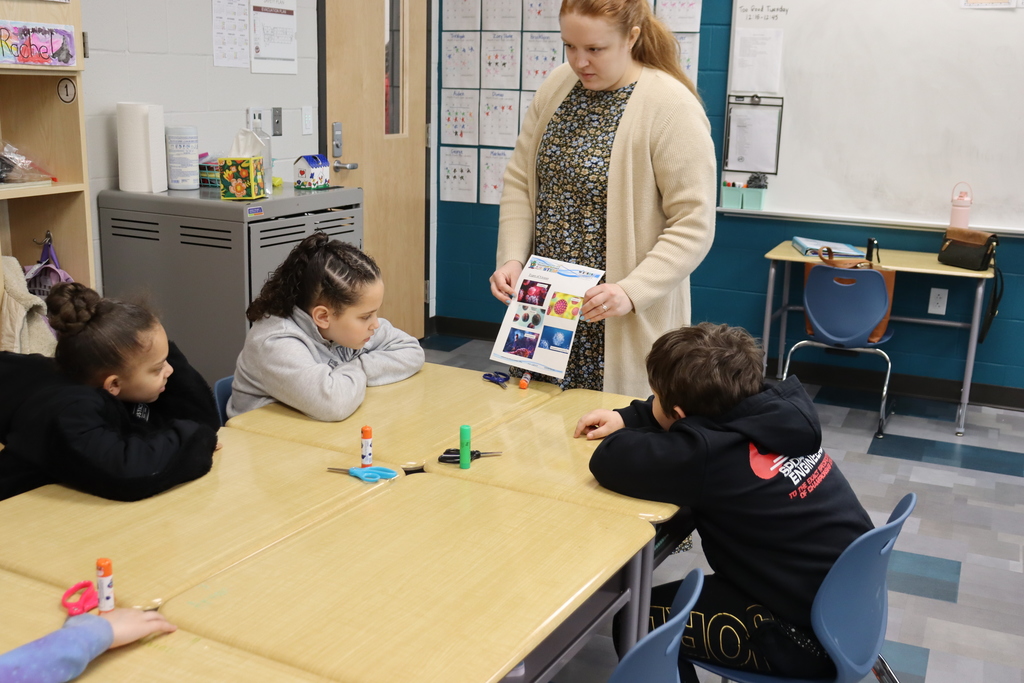 Students looking at a picture of germs