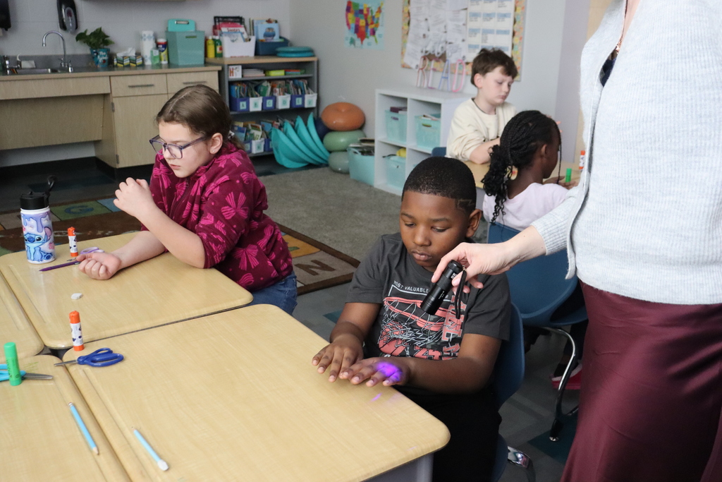 hands under a UV light