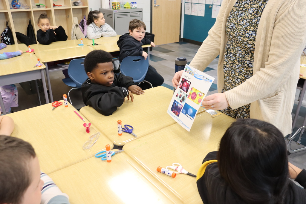 Boy looking at a picture of germs