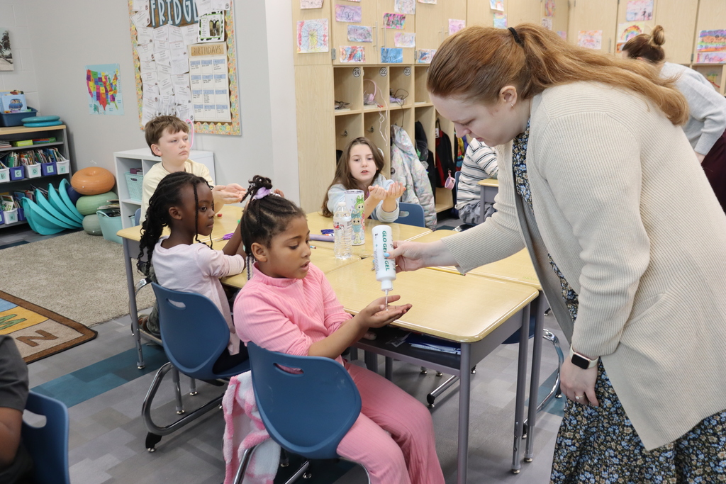 Student getting lotion in their hands