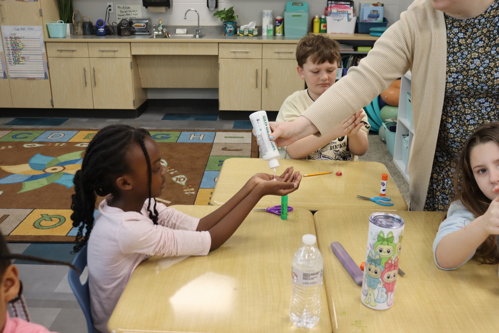 Student getting lotion in their hands
