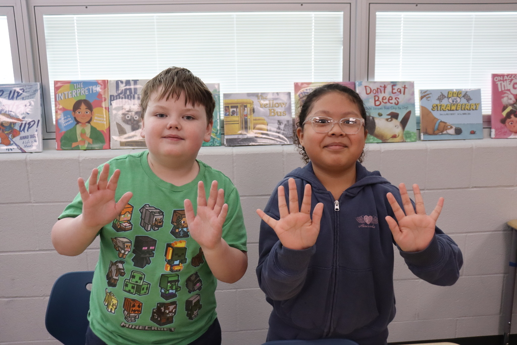 boy and girl showing their clean hands