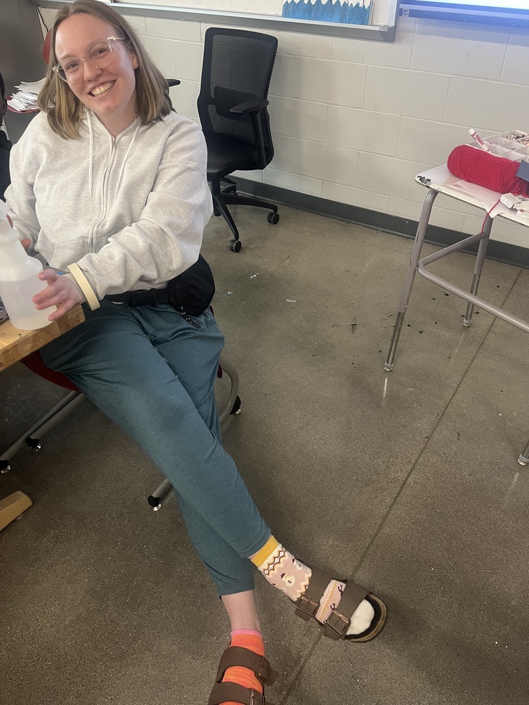 Staff member wearing mismatched socks
