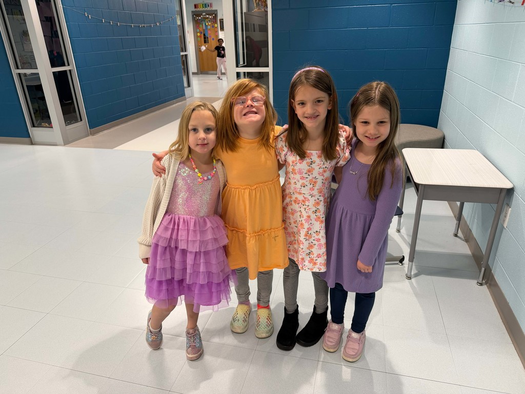 four girls in dresses