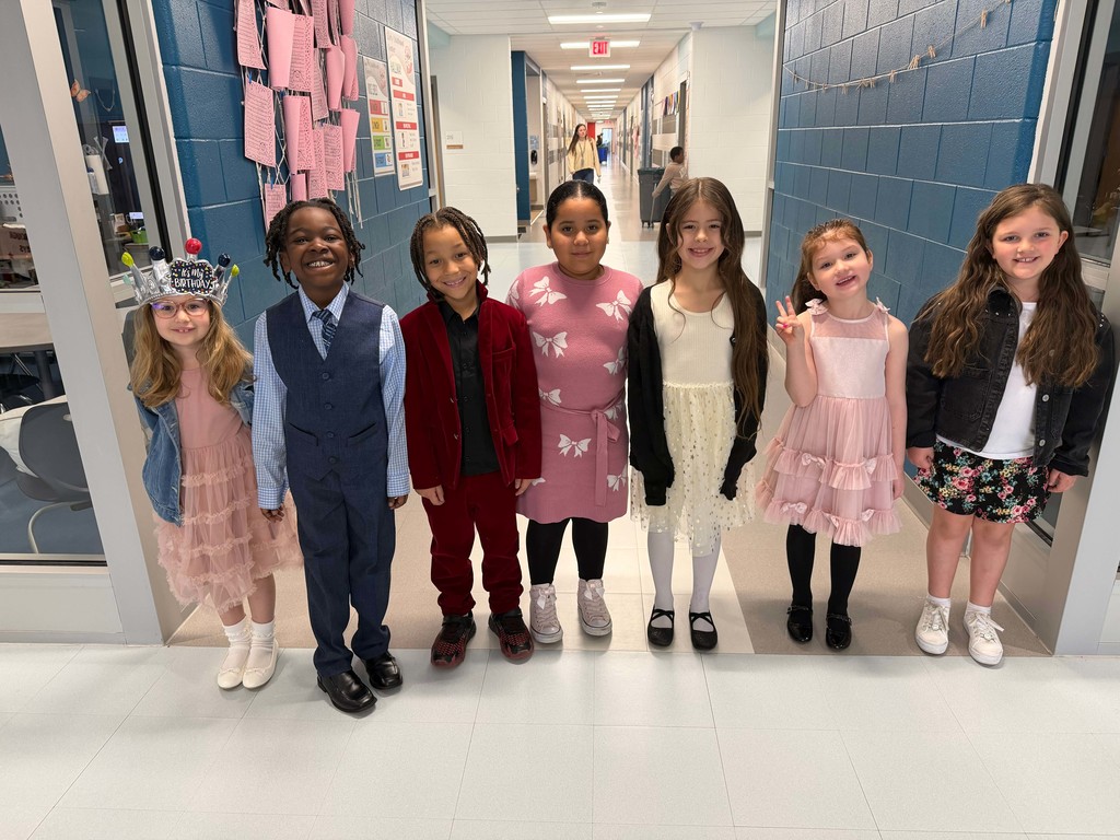 7 first grade students in dressy clothes