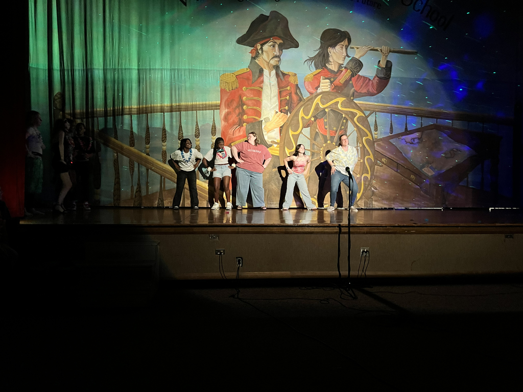 staff and students dancing together