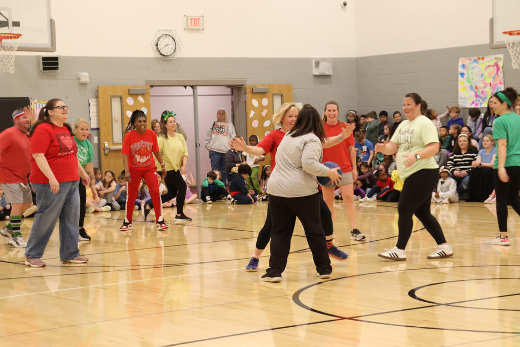 School staff playing basketball 