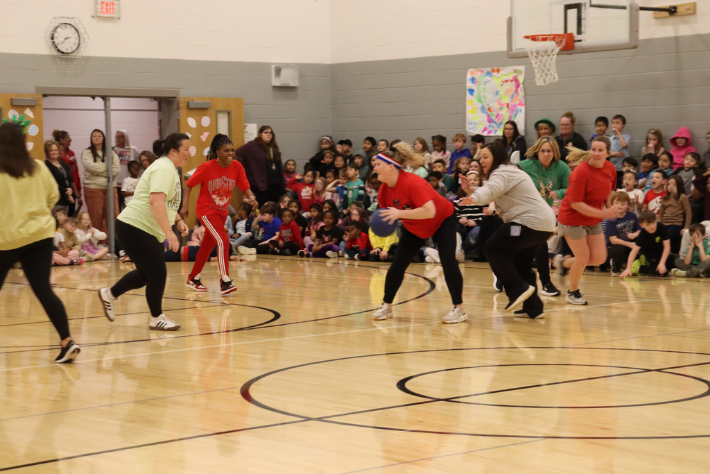 School staff playing basketball 