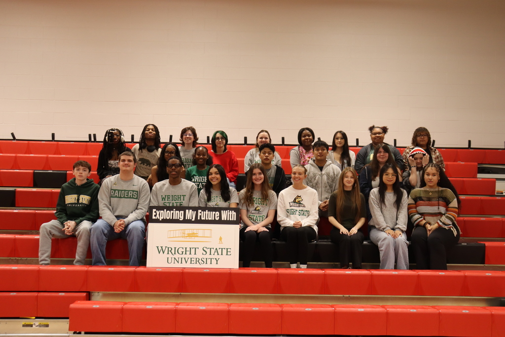 Group photo on red bleachers with a banner reading "Exploring My Future with Wright State University".