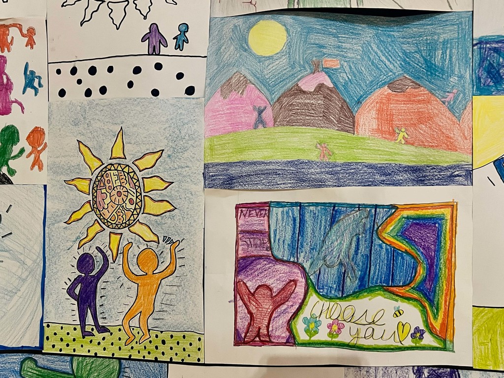Multiple colorful drawings on white paper with people, landscapes, and a sun, arranged in a grid pattern.