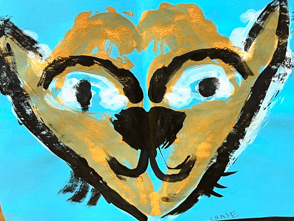 Abstract painting of a cat with blue eyes, yellow face, black outline, and blue background.