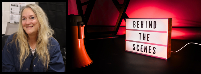 Woman with blonde hair in blue top. Neon sign says "Behind the Scenes" with red light in background.
