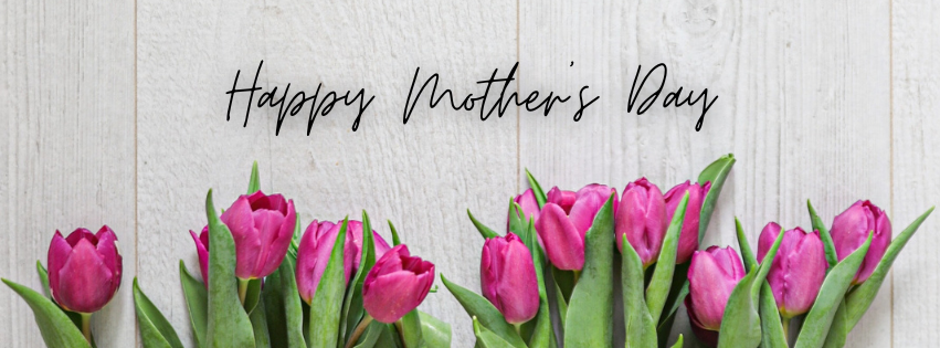Bouquet of pink tulips against a white wooden background. Text above reads "Happy Mother's Day".