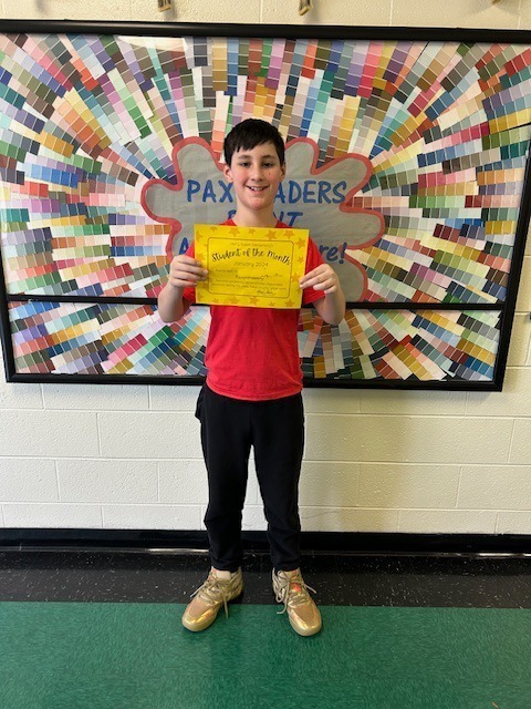 Dominic receiving January student of the month award