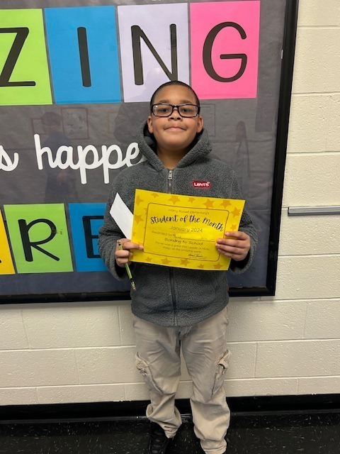 Daniel receiving January student of the month award