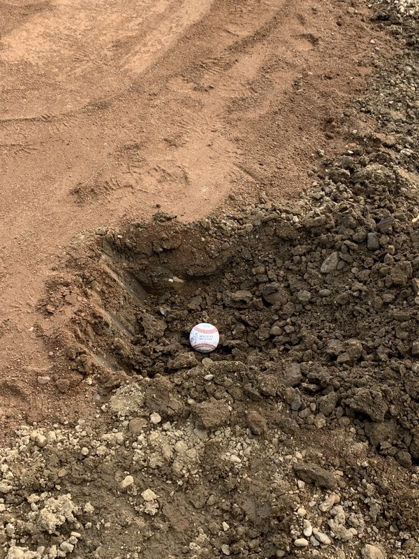 Baseball in dirt