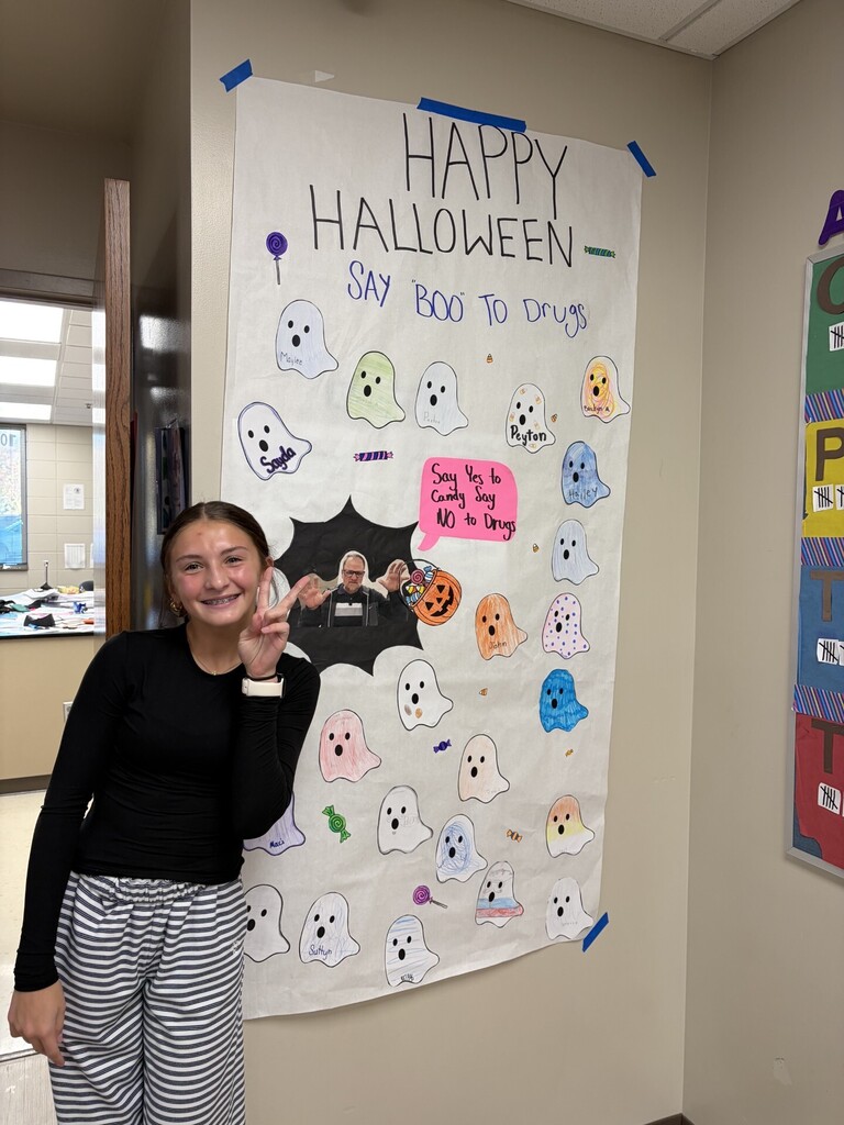 8th Grade Mr. Caffrey's Advisory working on door decorating