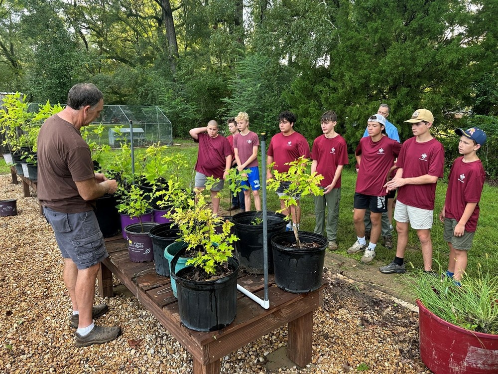 📸 Pictured: William Daniel, President of the Friends of Cat Island, teaching Troop 61 how to identify tree species.
