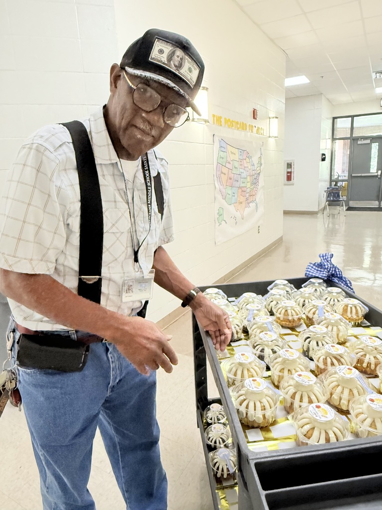 Staff member enjoys cake compliments of The GaP!