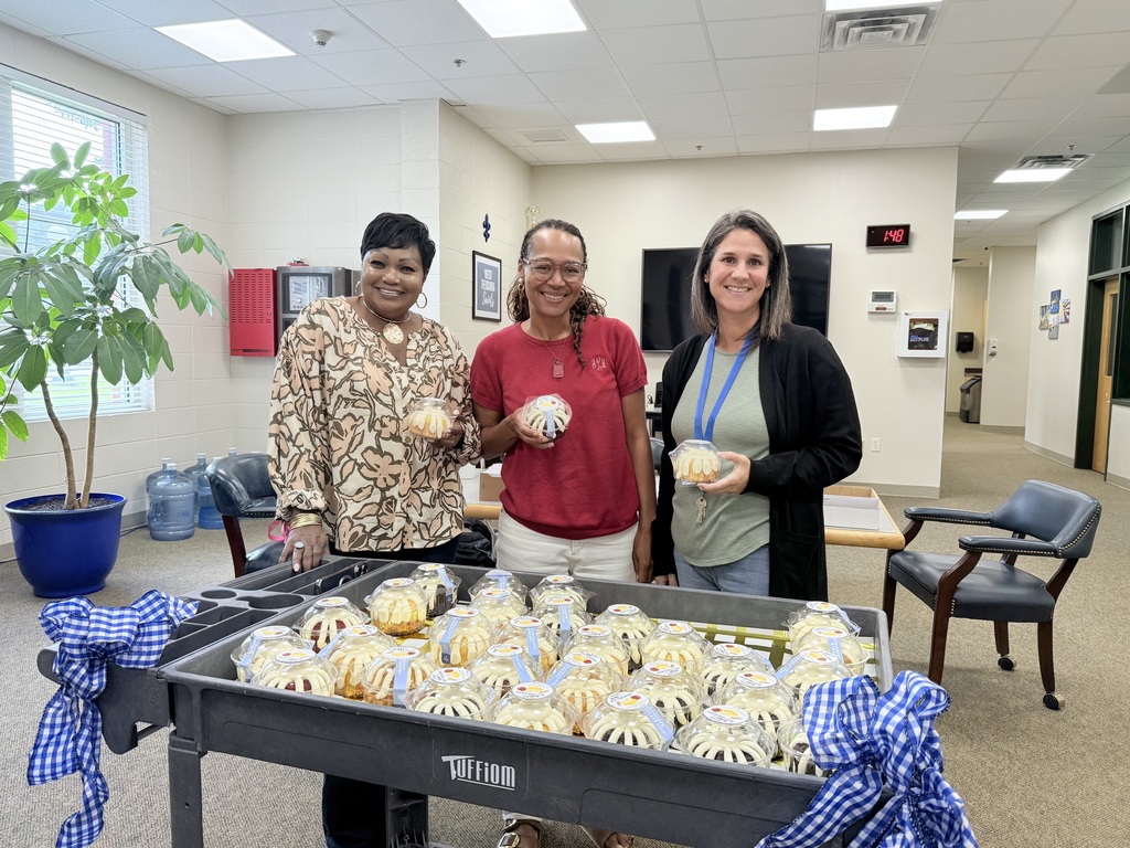 The office staff enjoys cake compliments of The GaP!