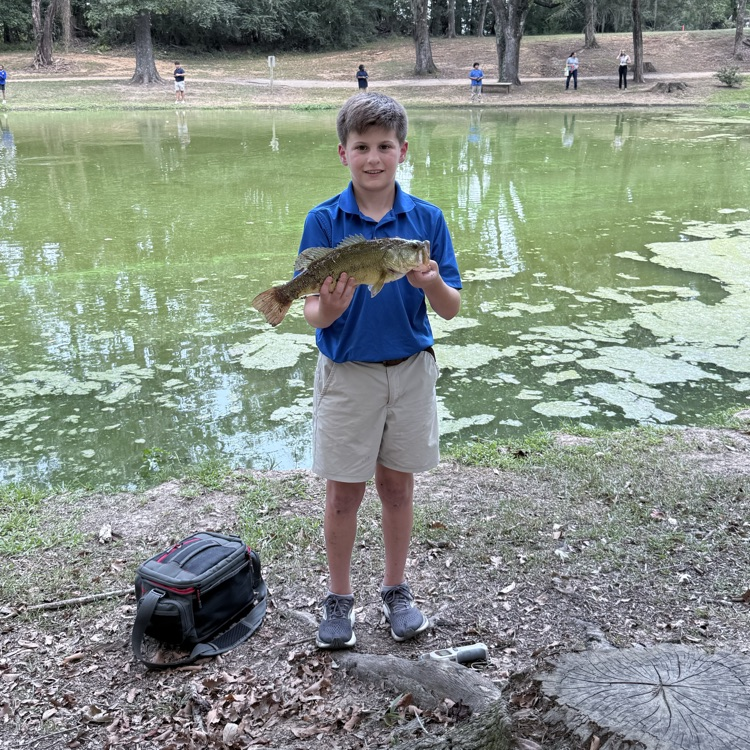 Ben Suggs catches a fish  