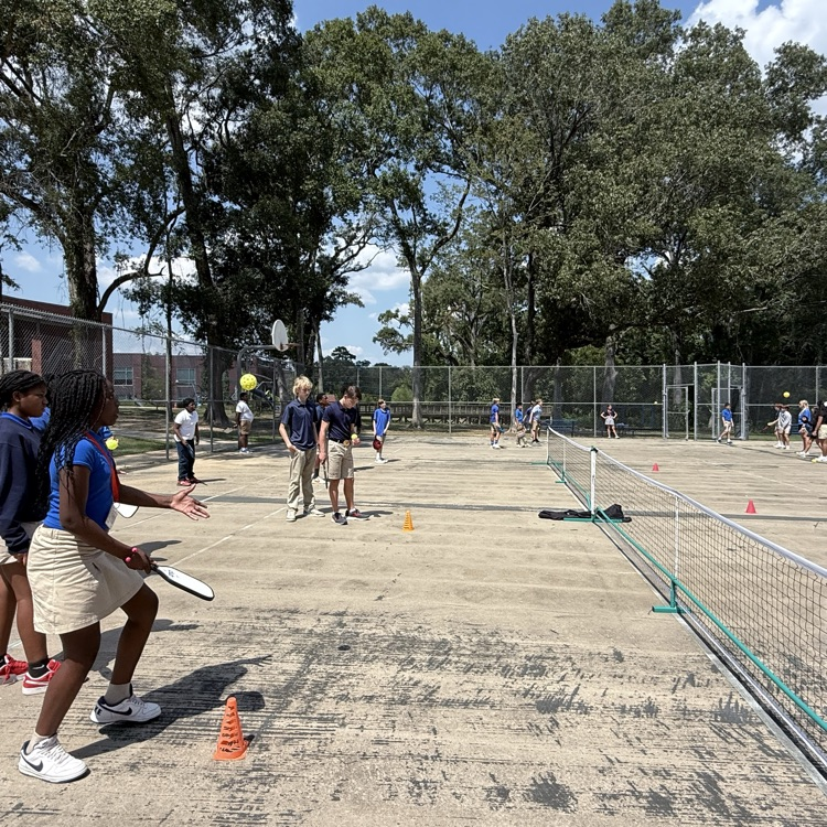 Students play pickleball. 