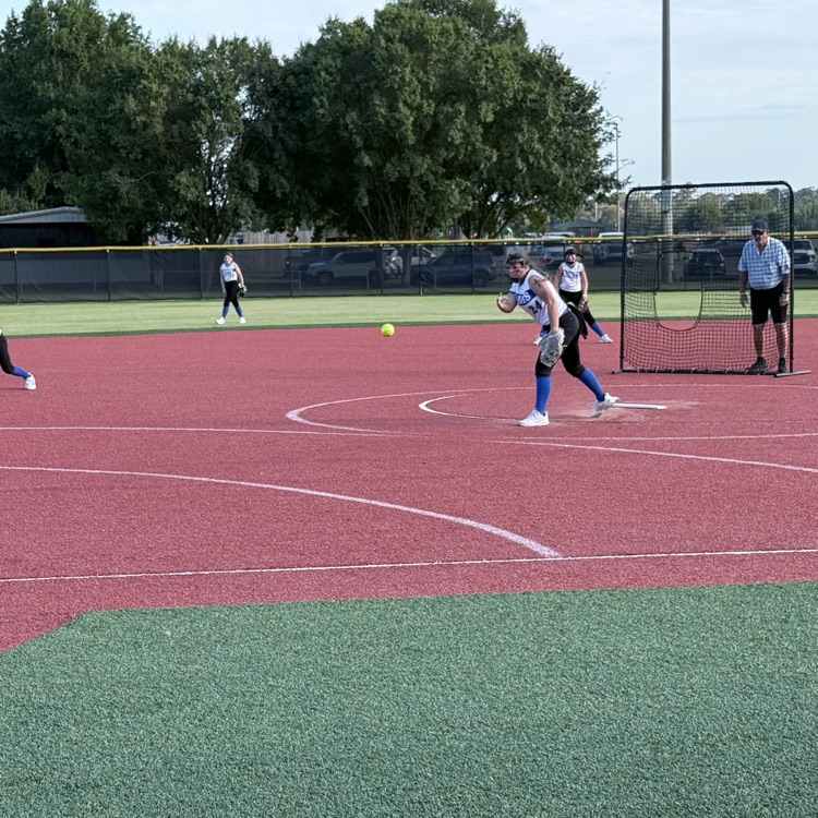 Pitcher throwing ball to home plate