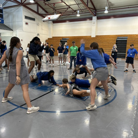 Students play a game at the meeting.