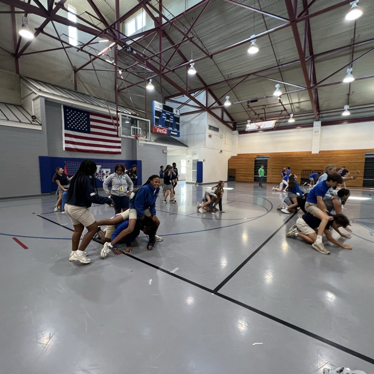 Students play a game at the meeting.