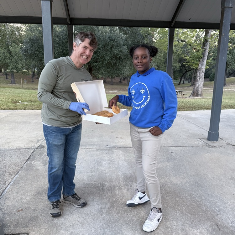 WyldLife sponsors give out donuts. 