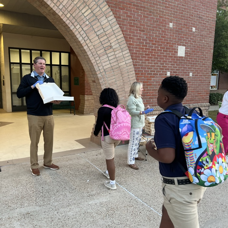 WyldLife sponsors give out donuts. 