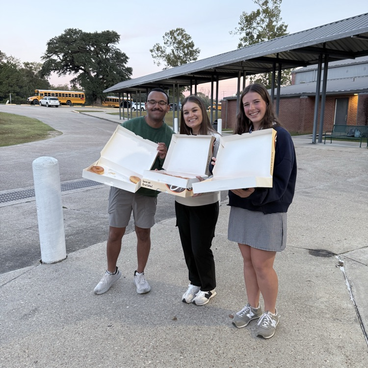 WyldLife sponsors give out donuts. 