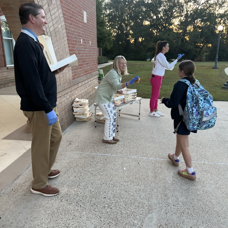 WyldLife sponsors give out donuts. 