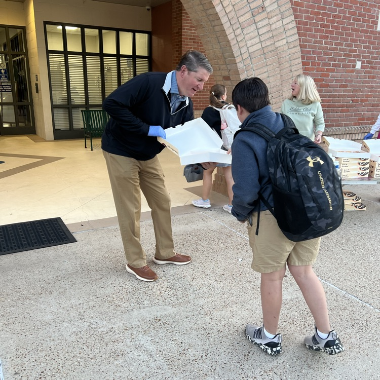 WyldLife sponsors give out donuts. 