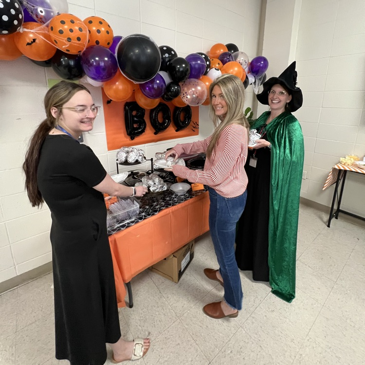 staff members grab a potato at the potato bar