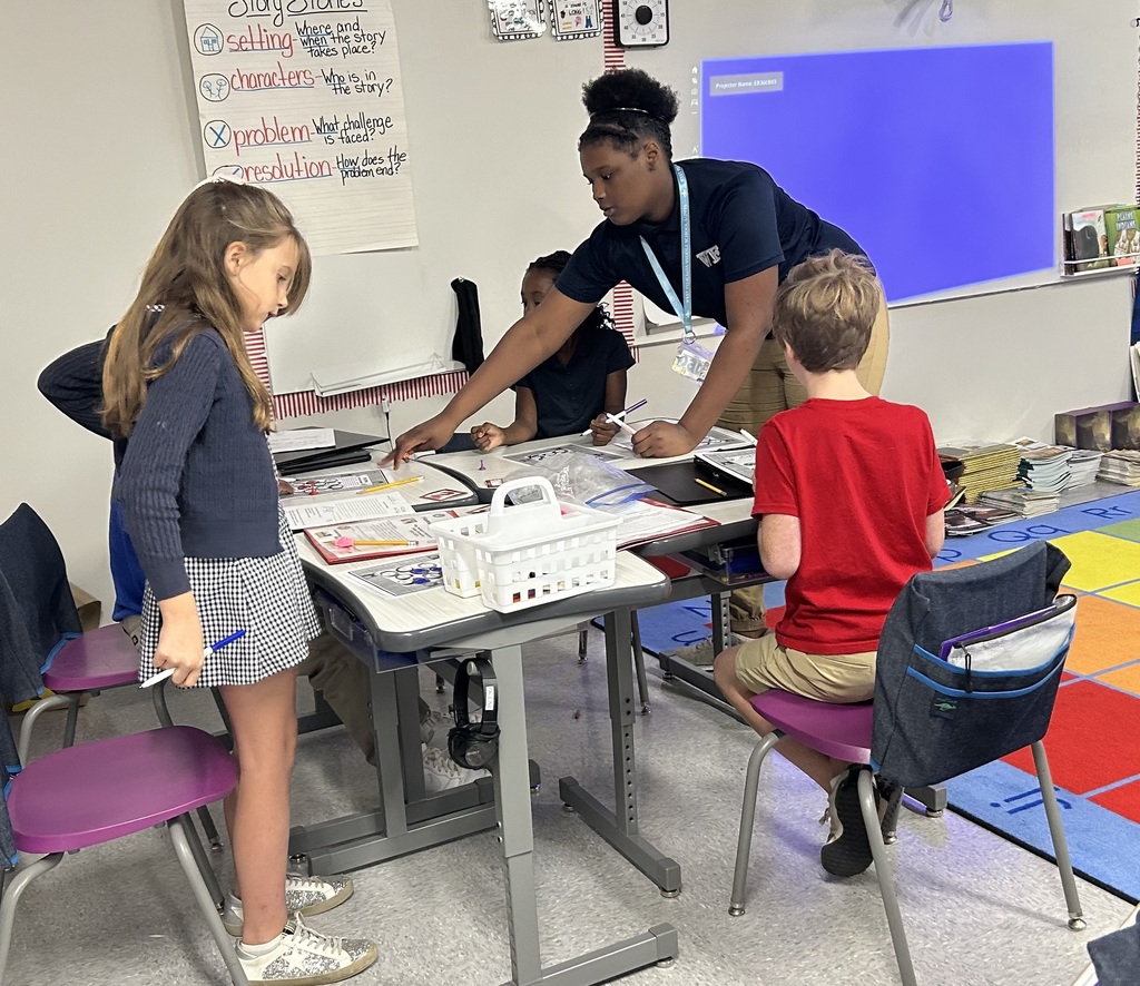 8th graders help elementary students with math.