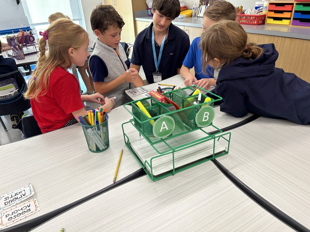 8th graders help elementary students with math.