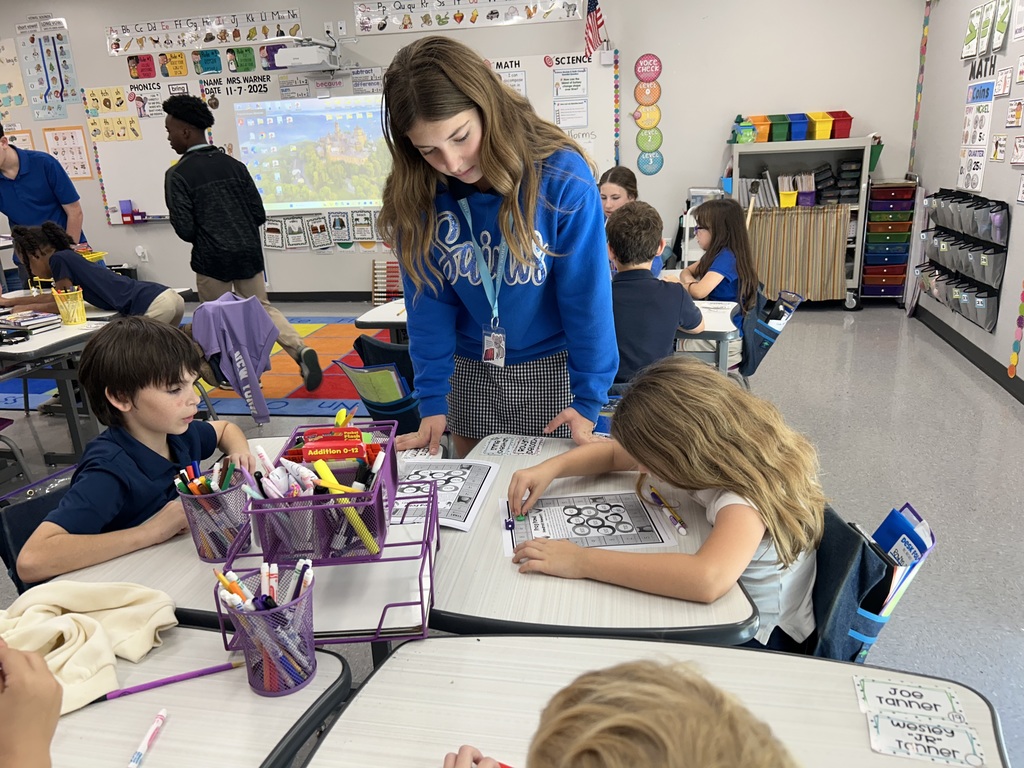 8th graders help elementary students with math.
