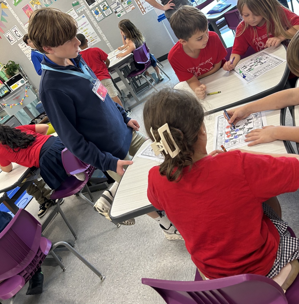 8th graders help elementary students with math.