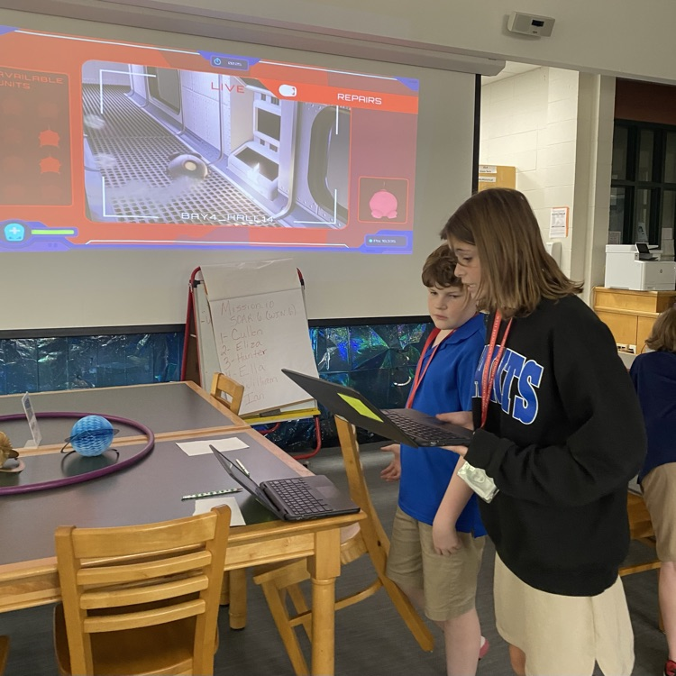 Students play online problems solving game