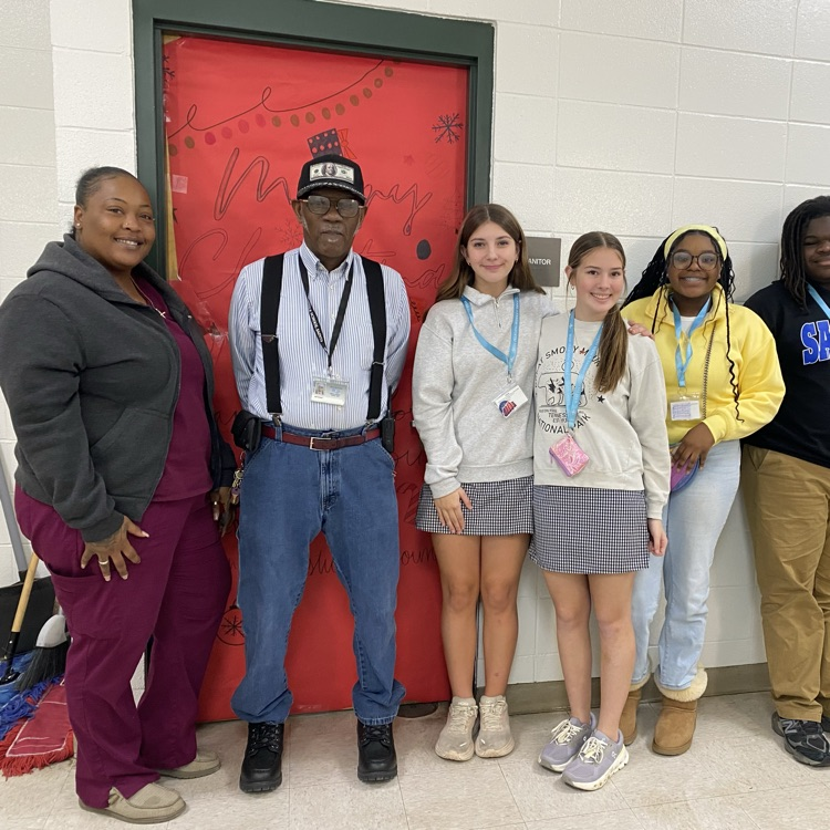 Students pictured with Custodian 